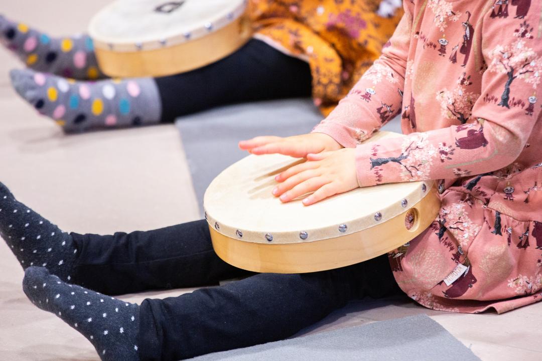 Child playing drum