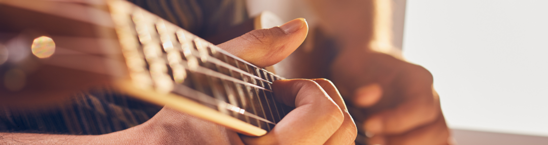 A person playing a guitar